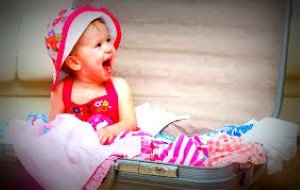 Image of baby in suitcase